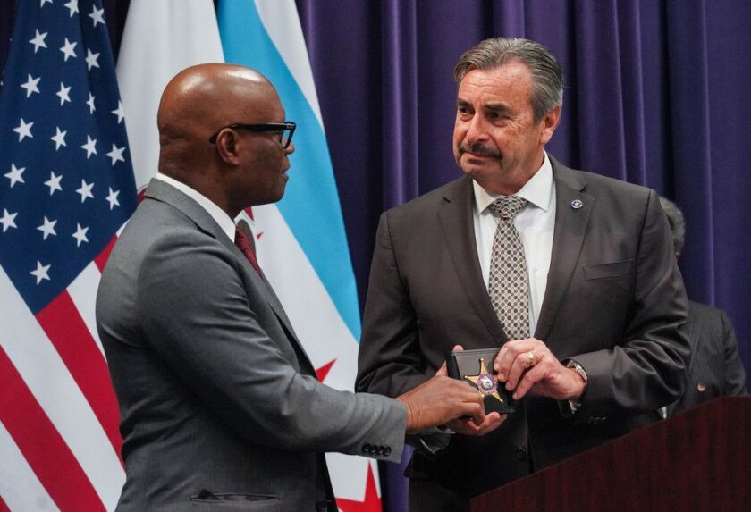 Now-former interim police Supt. Charlie Beck presented David Brown with the superintendent badge at his farewell ceremony on April 15, 2020.