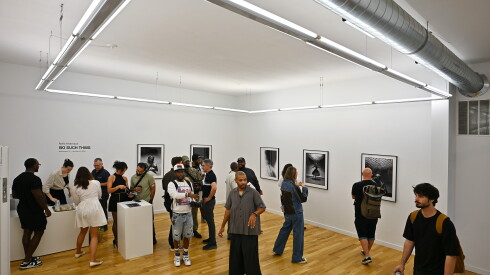 Visitors view black-and-white photography from artist Nolis Anderson’s exhibition, "No Such Thing," at Elise Seigenthaler Gallery during Chicago Exhibition Week.