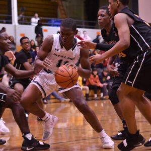 DePaul Prep’s Perry Cowan Jr. (11) keeps the ball. Worsom Robinson/For the Sun-Times.