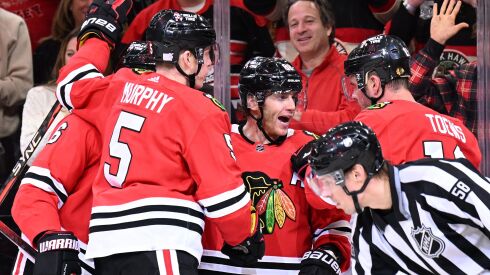 Patrick Kane celebrates his goal Sunday against the Penguins.