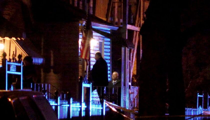 Police went door to door near 103rd Street and South Avenue N Wednesday night seeking information on a shooting that left an 11-year-old boy seriously wounded. | Justin Jackson/Sun-Times