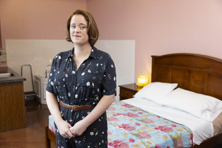 Meghan Nolan, director of reproductive services at Perinatal Child Health Care Coordination, poses for a portrait in one of the birthing rooms at PCC Community Wellness Center in Chicago.