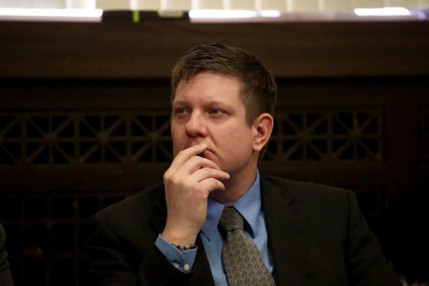 Jason Van Dyke sits at the defense table, listening to his attorneys on Thursday Jan. 18, 2018 at the Leighton Criminal Courts Building in Chicago.
