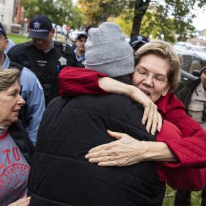 Presidential candidate U.S. Sen. Elizabeth Warren (D-MA) greets Cook County Commissioner Brandon Johnson as she joins striking Chicago Teachers Union and SEIU Local 73 members for a speech on the picket line outside Oscar DePriest Elementary School.