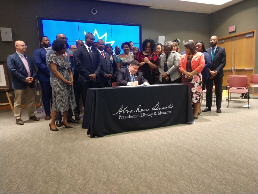 Gov. J.B. Pritzker signs a bill making Juneteenth a state holiday Wednesday, June 16, 2021.