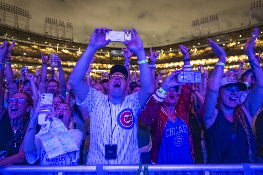 Fans cheer as Mumford and Sons performs at Wrigley Field after sever storms delayed the show, Thursday, June 11, 2026.