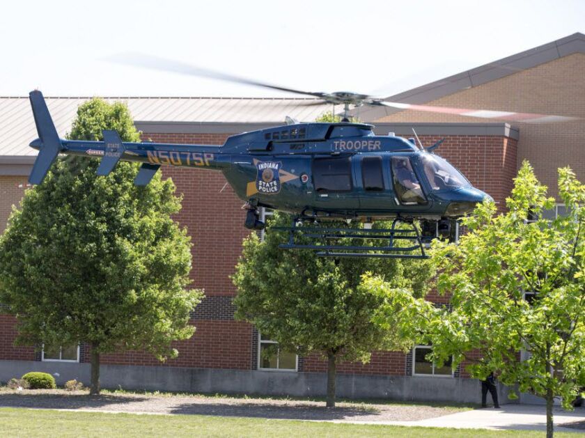 A boy opened fire at a suburban Indianapolis school wounding another student and a teacher before being taken into custody, authorities said. | Robert Scheer/The Indianapolis Star via AP