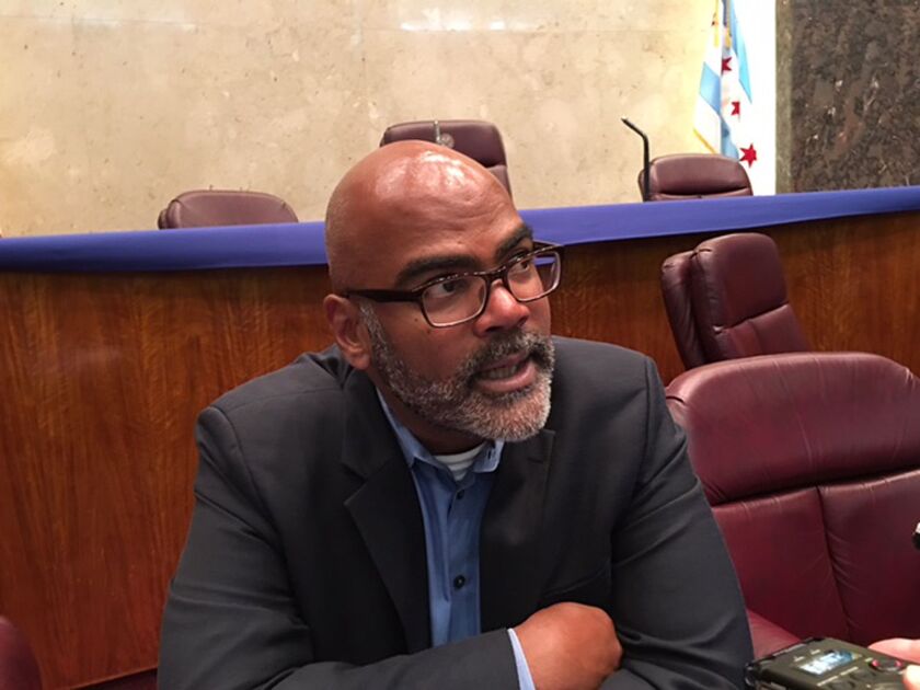 Mike Merchants, intergovernmental affairs chief for McPier, talks to reporters at City Hall on Tuesday about the plan to hire moonlighting police officers to beef up security on the McCormick Place campus. | Fran Spielman/Sun-Times