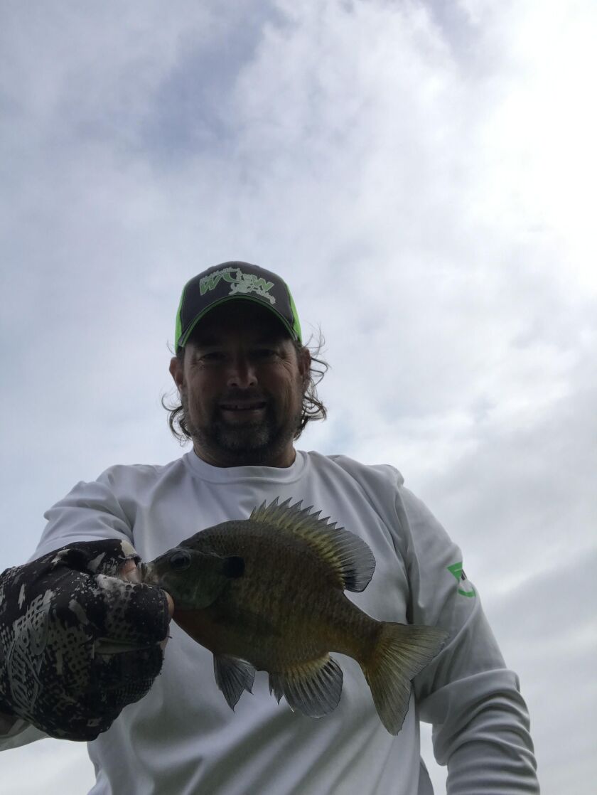 Ken “Husker” O’Malley with a good summer bluegill. Provided photo