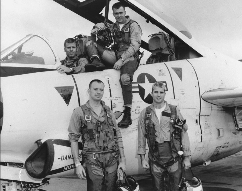 In a 1965 photo seen in “John McCain: For Whom the Bell Tolls,” Navy pilot McCain (right) is seen with his squadron and T-2 Buckeye trainer. | HBO