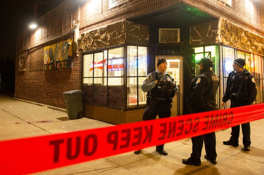 Chicago Police investigate a man shot Monday night in the 7500 block of South Stewart in the Englewood neighborhood. | Tyler LaRiviere/Sun-Times