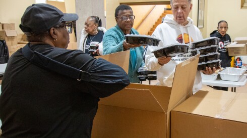 Volunteers pack Christmas dinners and toys at Saint Sabina Church, Thursday, Dec. 25, 2025. | Arthur Maiorella/For the Sun-Times