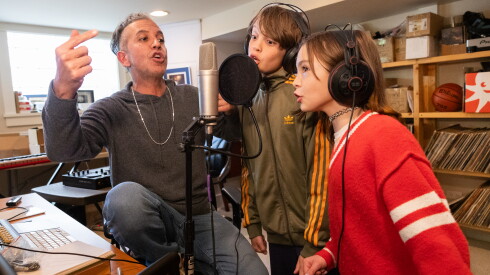 Jeffrey “JQ” Qaiyum, an Emmy Award-winning composer and founding member of the hip-hop and theater fusion group the Q Brothers, rehearses with his son, JJ, 12, and daughter, Cora, at the studio in the family’s Northwest Side home, Thursday, April 30, 2026.
