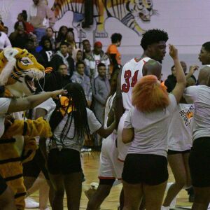 Bogan’s fans rush the court. Worsom Robinson/For the Sun-Times.