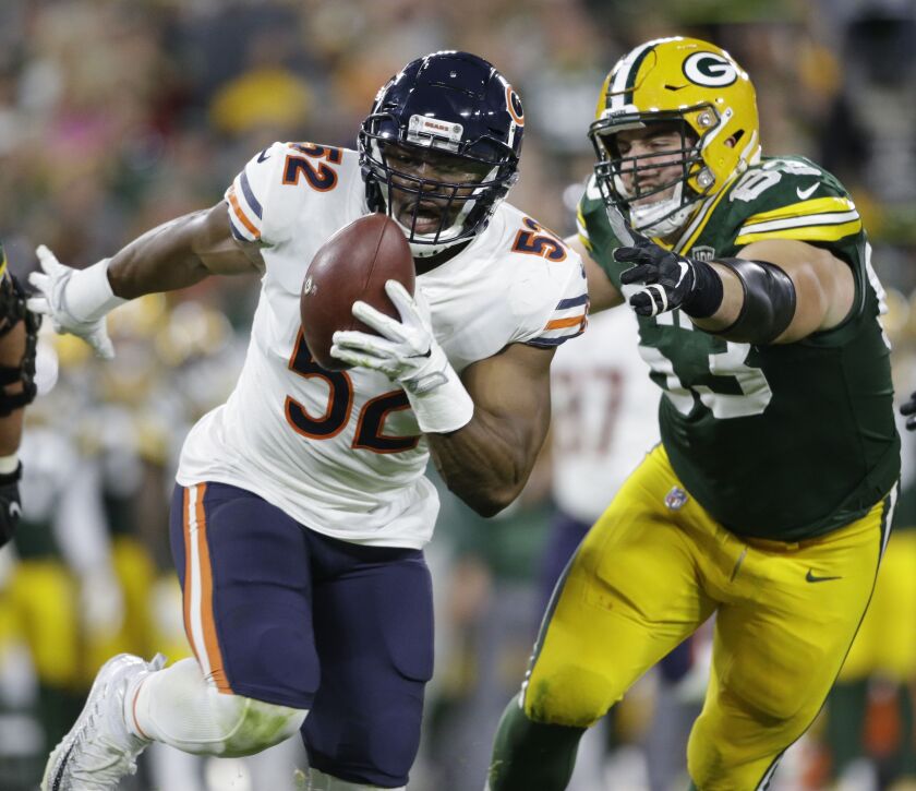 In this Sept. 9, 2018, file photo, Chicago Bears’ Khalil Mack intercepts a pass and returns it for a touchdown during the first half of an NFL football game against the Green Bay Packers, in Green Bay, Wis. The Chicago Bears have a chance to tighten their