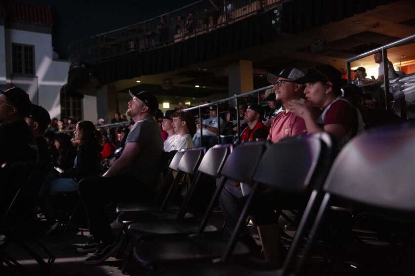 Andrew Vikre sits among the crowd during a watch party at Ramova Theatre in Bridgeport for Game 5 of the American League Division Series between the White Sox and Cleveland Guardians.