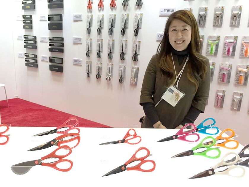 Naomi Ogawa, of B.H.P. Industries in Japan, shows off scissors at the 2017 International Home + Housewares Show at McCormick Place. | Neil Steinberg/Sun-Times