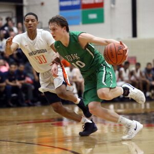 York’s Nathan Shockey (10) drives around Whitney Young’s Justin Warren (11) in their 58-56 loss in Hillside, Wednesday, March 6, 2019. | Kevin Tanaka/For the Sun Times