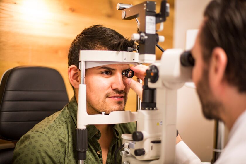 Jose Duran, who suffers from dry eyes, gets his vision checked at the LensCrafters on Southport in Lake View, Tuesday, August 15, 2017. | James Foster/For the Sun-Times