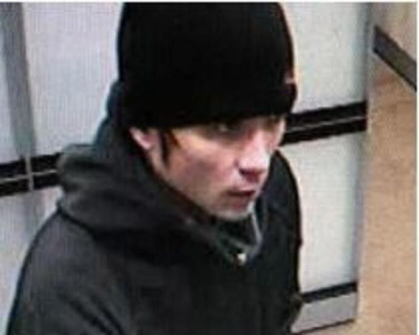 Surveillance image of the man who robbed a Chase Bank branch Dec. 12 in Addison. | FBI