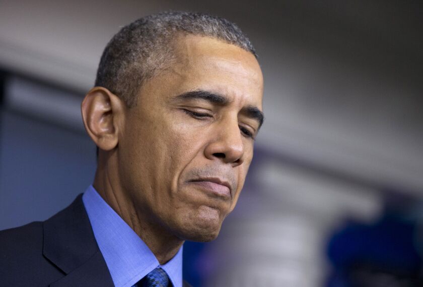 At the White House on Thursday, President Barack Obama pauses while speaking about the church shooting Wednesday night in Charleston, S.C. | Manuel Balce Ceneta/AP