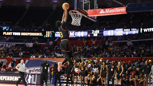 Marshall's Rayvon Myles (3) throws down a dunk in the fourth quarter as the Commandos defeat Goreville 52-44.