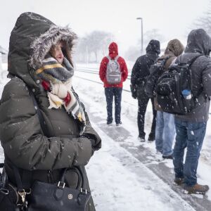 Carol Vervoort waits at the Naperville Metra station Monday morning. | Rich Hein/Sun-Times