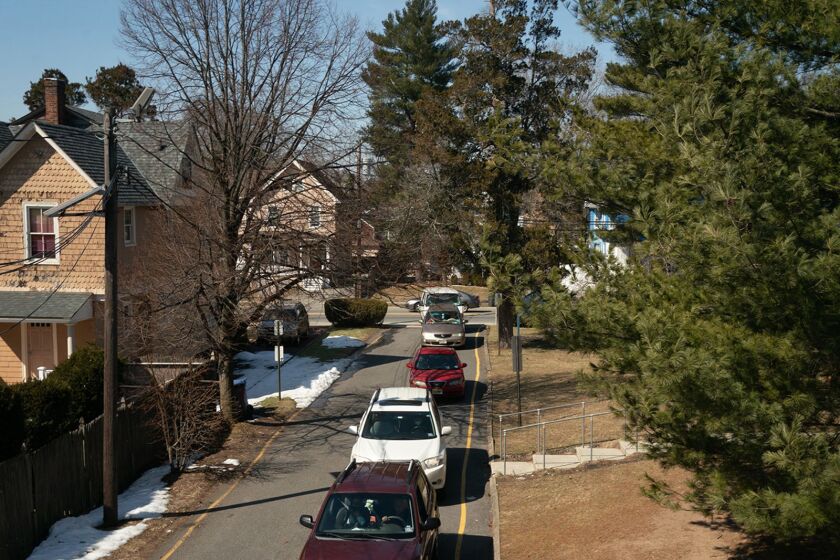 Cars line up to receive food boxes at the Center for Food Action in Englewood, New Jersey. The center helped 40,500 households last year, up from 23,000 the year before.