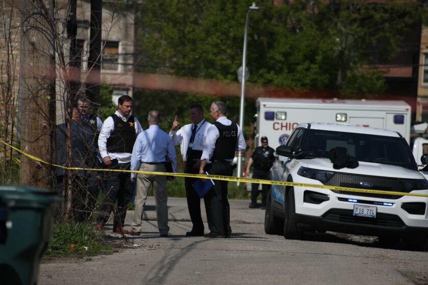 Chicago police investigate the scene where two officers were shot May 16, 2021, in Lawndale.
