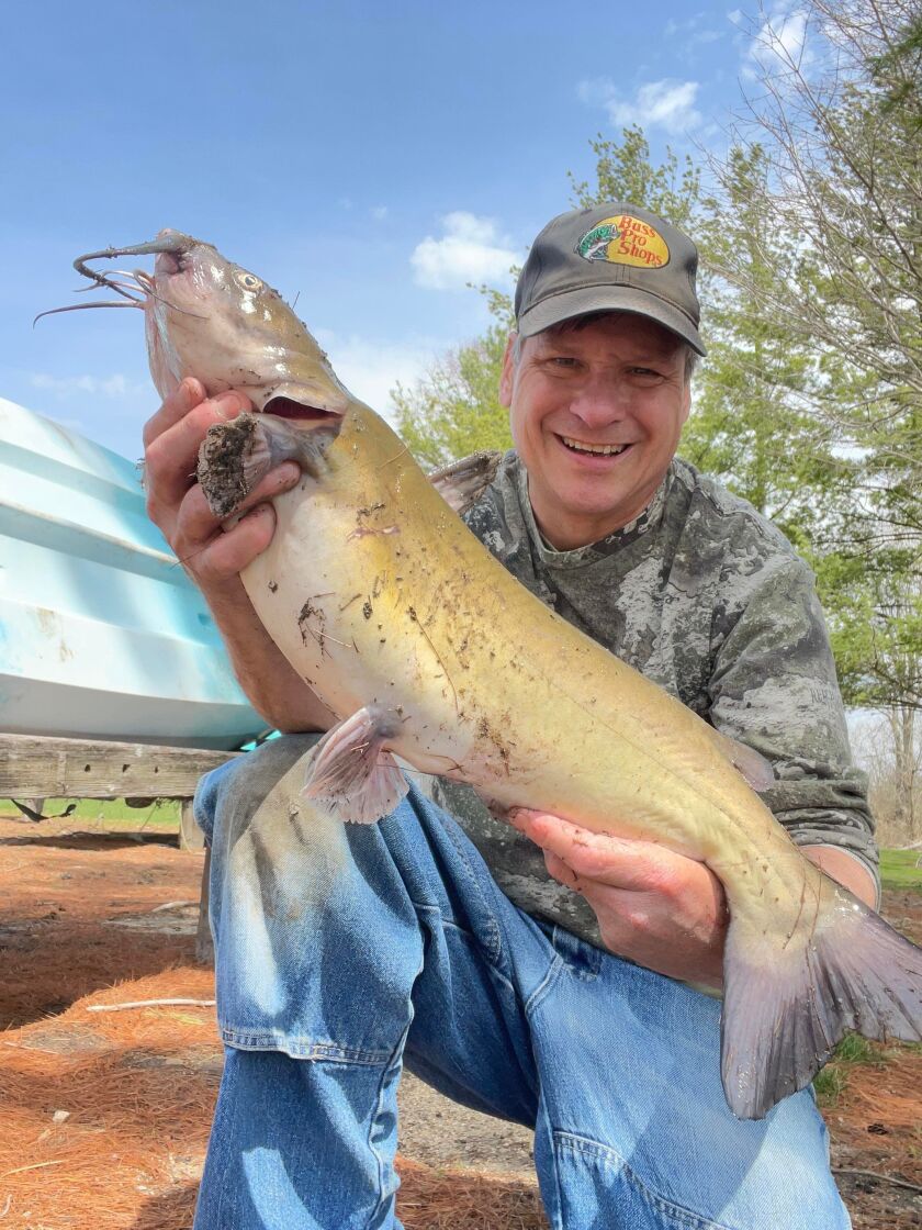 John Cachel with a good channel catfish from the Rock River. Provided photo