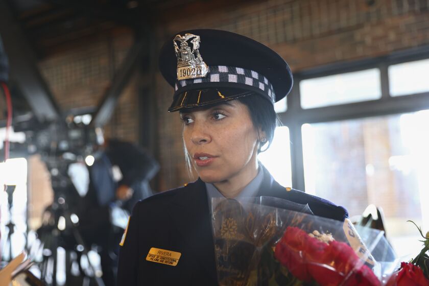 Newly graduated police officer Krystal Rivera talks about why she decided to become an officer after a graduation ceremony, Wednesday, Oct. 20, 2021 at Navy Pier. She said she wanted to become a police officer because of the opportunity to help others.