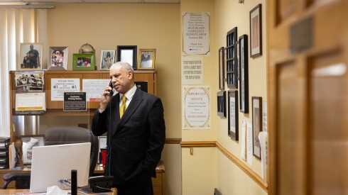 Spencer Leak Jr. takes a phone call in his office.