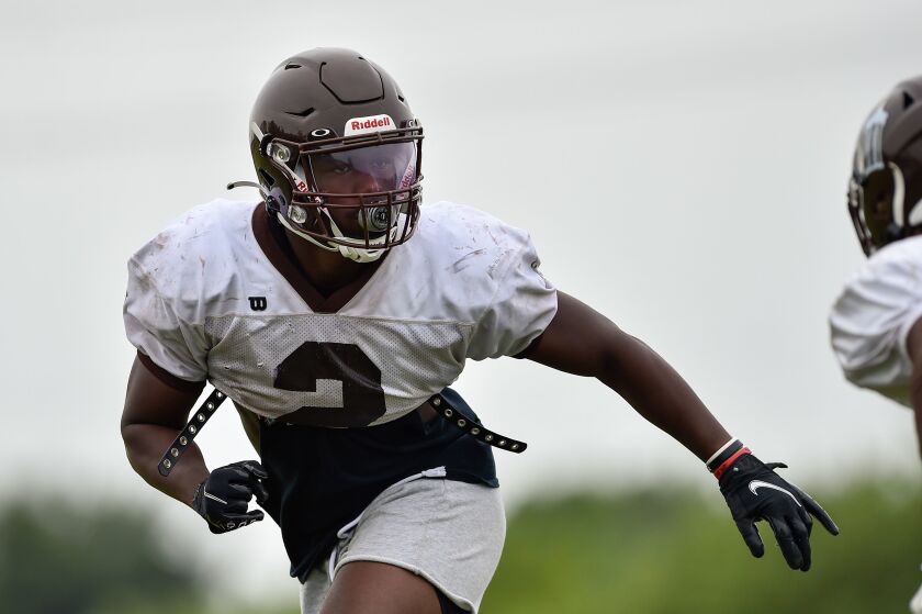 Joliet Catholic’s Malachi Hood runs a drill during football practice on August 12, 2021.