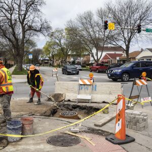 A Department of Water Management crew places a new catch basin cover — created by Neenah Foundry — on a rebuilt sewer frame at East 93rd Street and South Jeffery Boulevard on the South Side, Wednesday morning, April 27, 2022.