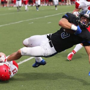 Lincoln-Way East’s Matt Judd (5) fights for an extra yard. Allen Cunningham/For the Sun-Times.