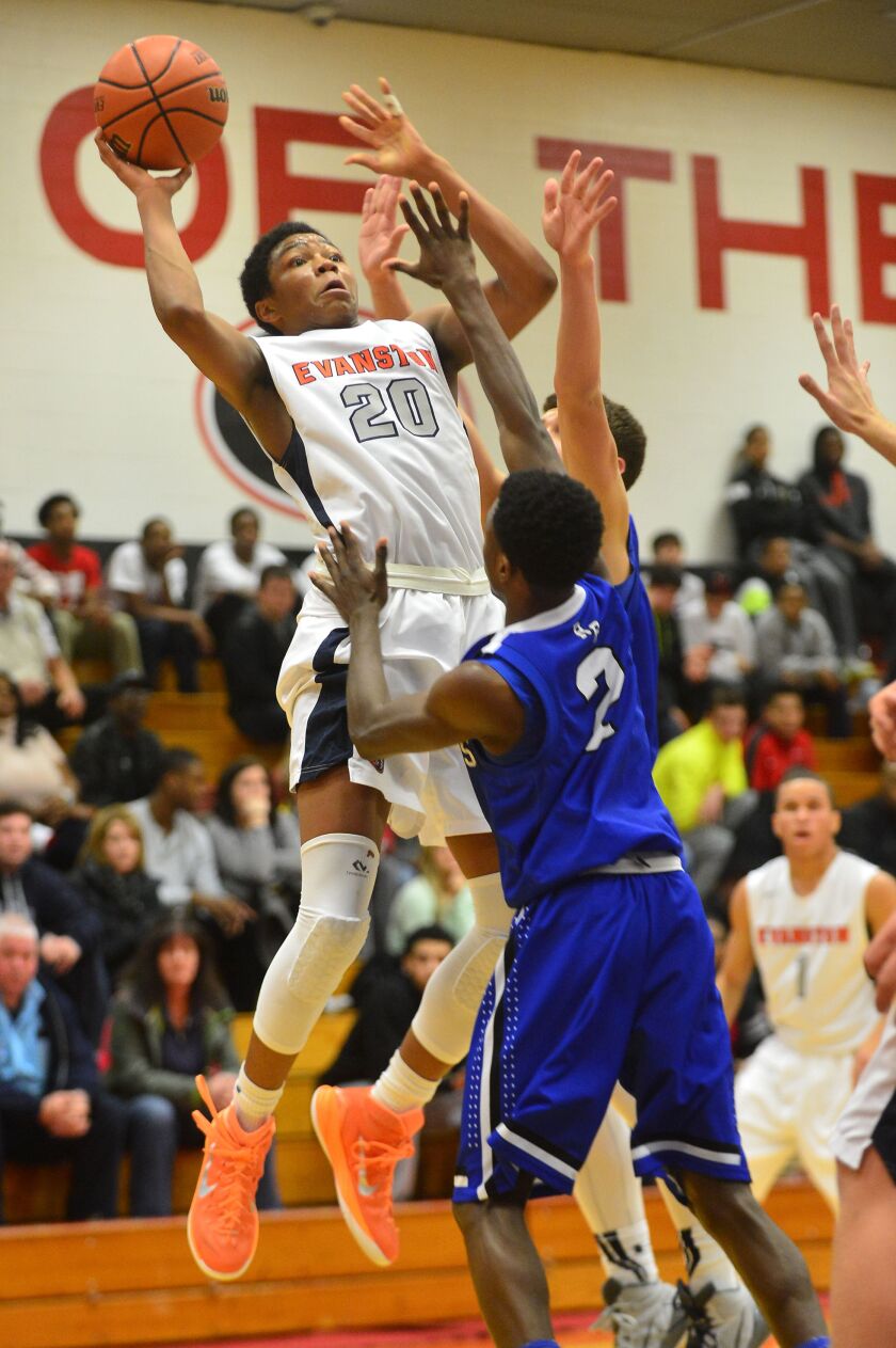 Evanston’s Nojel Eastern leaps to shoot over Riverside-Brookfield’s Jalen Clanton.