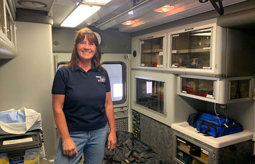 Dutton EMS Crew Chief Colleen Campbell at the Dutton ambulance barn.