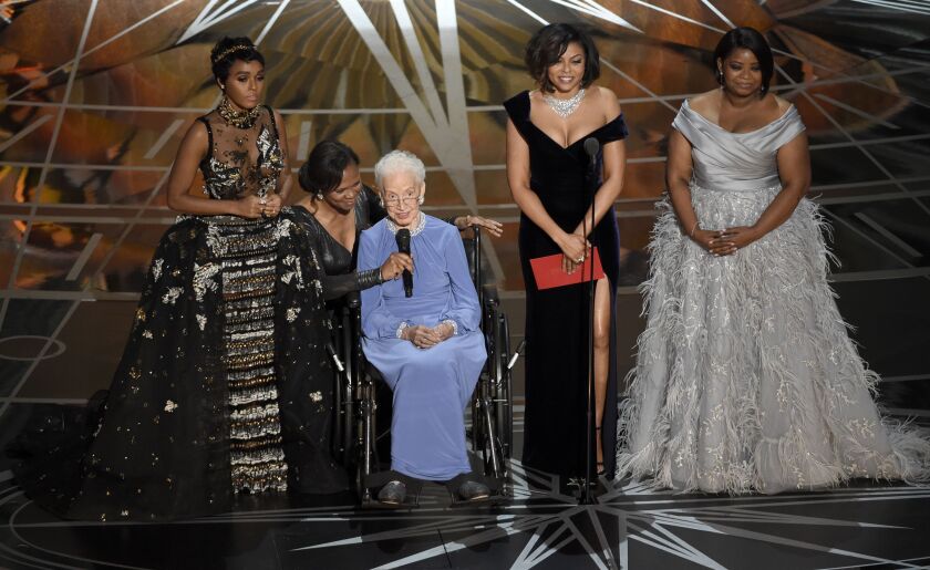Janelle Monae (left), Taraji P. Henson (second right), who played her in the movie, and Octavia Spencer (right) introducing the seated Katherine Johnson, the inspiration for “Hidden Figures,” as they presented the award for best documentary feature at the Oscars on Feb. 26, 2017.