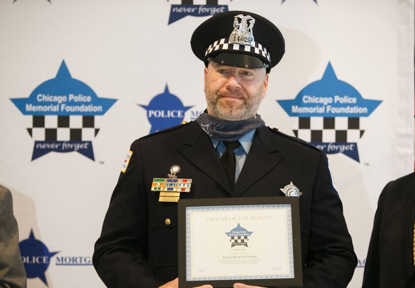 Officer Pete Gurskis said that he had “no other choice” but to use deadly force on the man. Officer Pete Gurskis stands with his award at the Chicago Patrolmen’s Federal Credit Union in West Loop, Tuesday morning, Oct. 12, 2021.