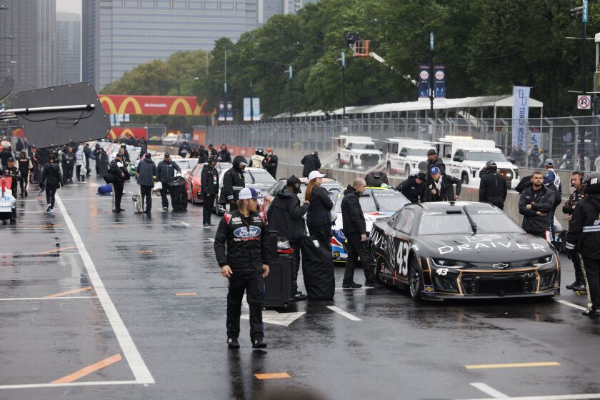 Team of NASCAR driver Erik Jones and other racers begins race prep prior to the Grant Park 220 NASCAR Street Race, Sunday, July 2, 2023.