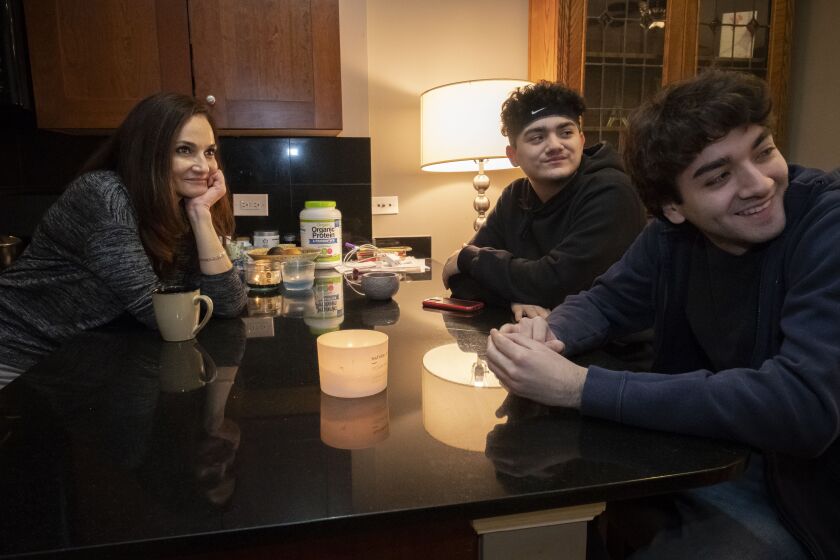 Alejandra Cano with her two sons Nico, center, and Emilio. The family waits to find out if Cano will be deported to Chile.
