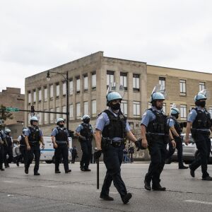 Chicago police officers respond to reports of looting and rioting near West Madison Street and South Karlov Avenue on the West Side, Monday afternoon, Aug. 10, 2020.