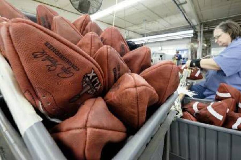 Official game balls for NFL football’s Super Bowl XLIX wait to be laced at the Wilson Sporting Goods Co. in Ada, Ohio, Tuesday, Jan. 20, 2015. The New England Patriots face the Seattle Seahawks for the NFL championship on Sunday, Feb. 1, 2015, in Glendal