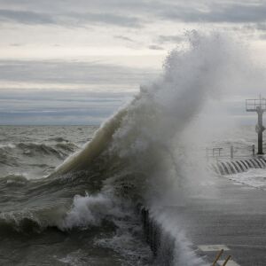 Strong waves crash along the Lake Michigan shoreline near 31st Street Beach, Thursday morning, April 6, 2017.