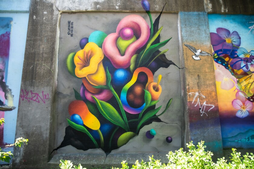 Flowers painted in yellow, pink, orange, blue and in a rainbow of colors adorn walls at Hubbard Street.