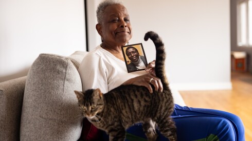 Phyllis Johnson holds a picture of her late partner, Barbra Smith, in her Roseland home.