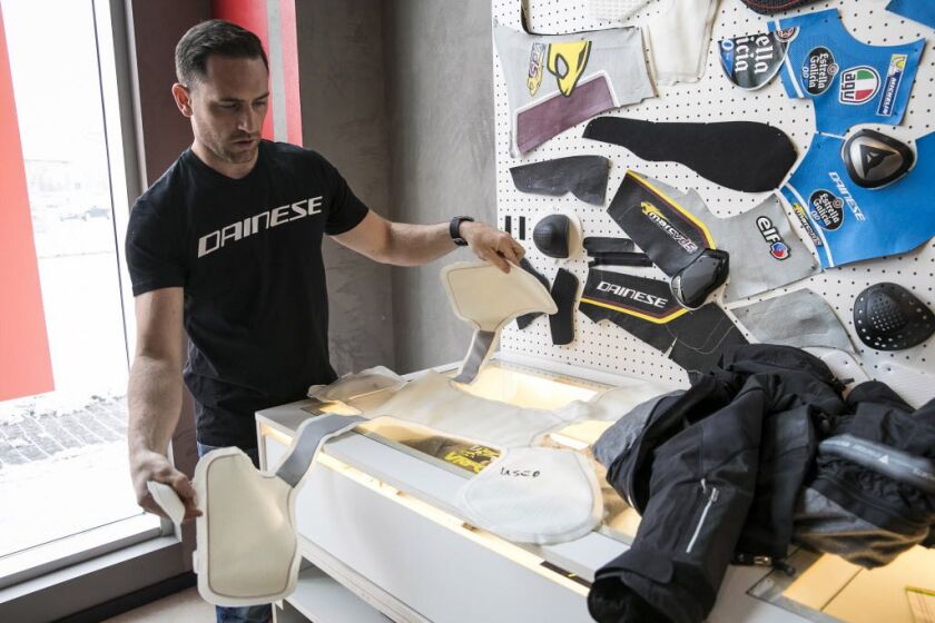 Peter Bacon, marketing manager for Dainese, demonstrates D-air technology. | Ashlee Rezin/Sun-Times