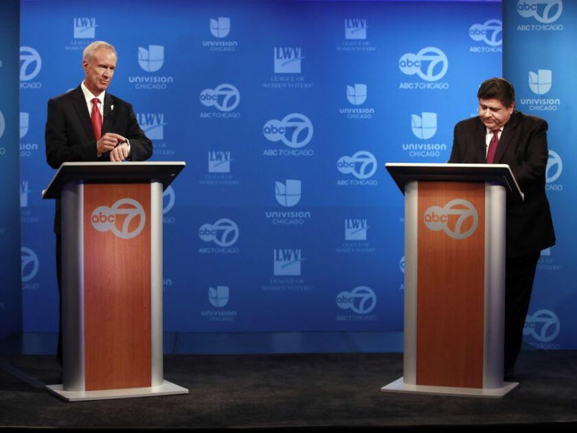 Gov. Bruce Rauner, left, and Democratic challenger J.B. Pritzker, right, before their televised debate at the ABC 7 studios, in Chicago, on Wednesday Oct. 3, 2018. (Nuccio DiNuzzo/Chicago Tribune via AP, Pool)