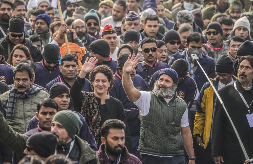 India’s opposition Congress party leader Rahul Gandhi, center right, and his sister and party leader Priyanka Vadra, center left, wave as they walk with their supporters during a five-month-long “Unite India March,” in Srinagar, Indian controlled Kashmir, Jan. 29, 2023.