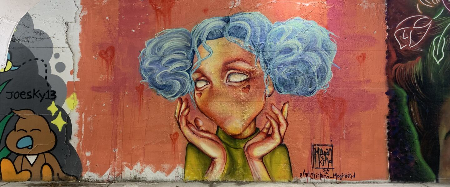 This mural was done by South Side native Megan Kind, who lives in East Humboldt Park. She primarily paints “characters that don’t have noses or a mouth” because, she says, “I want to focus on the eyes and a body language or some sort of movement.”